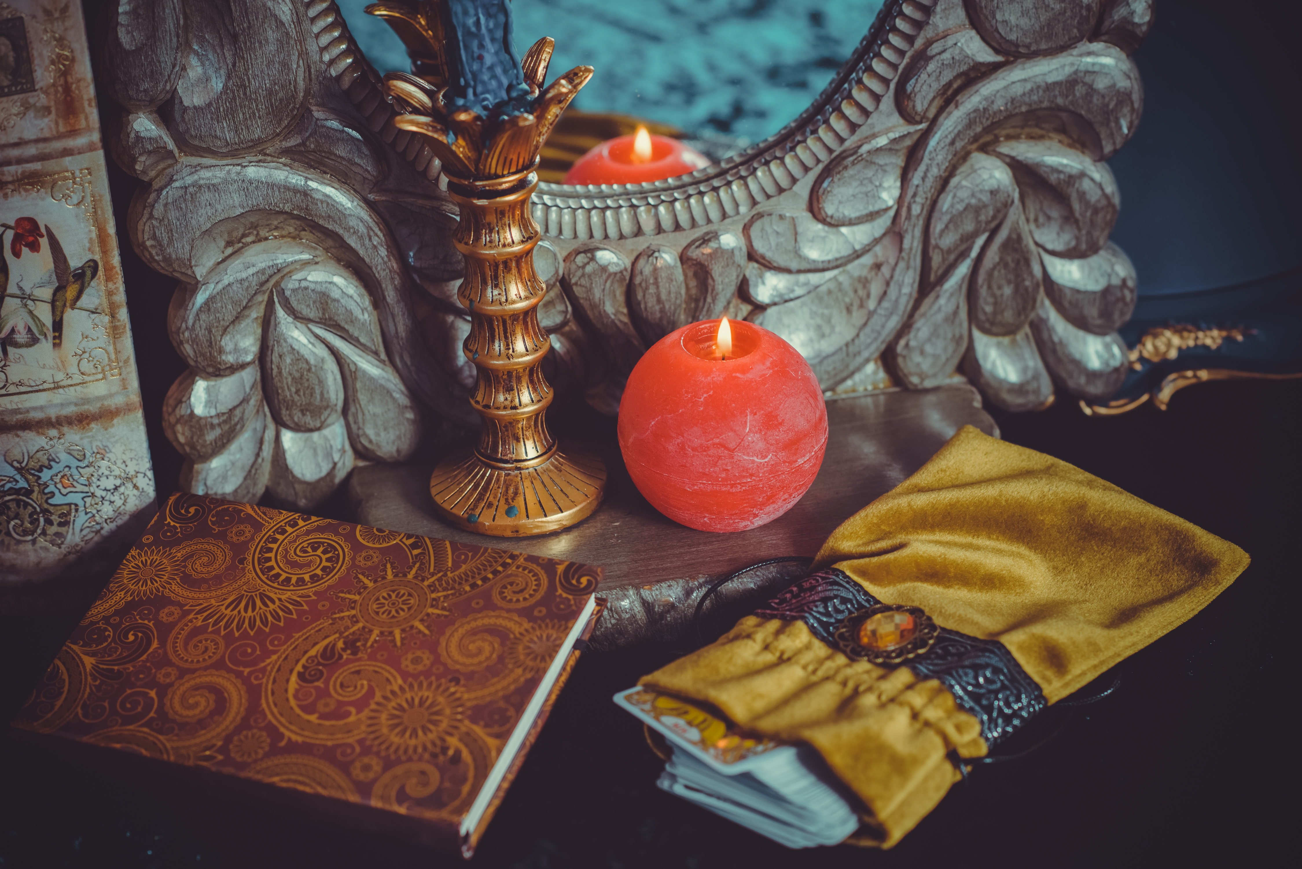 Candlelight beside a patterned book