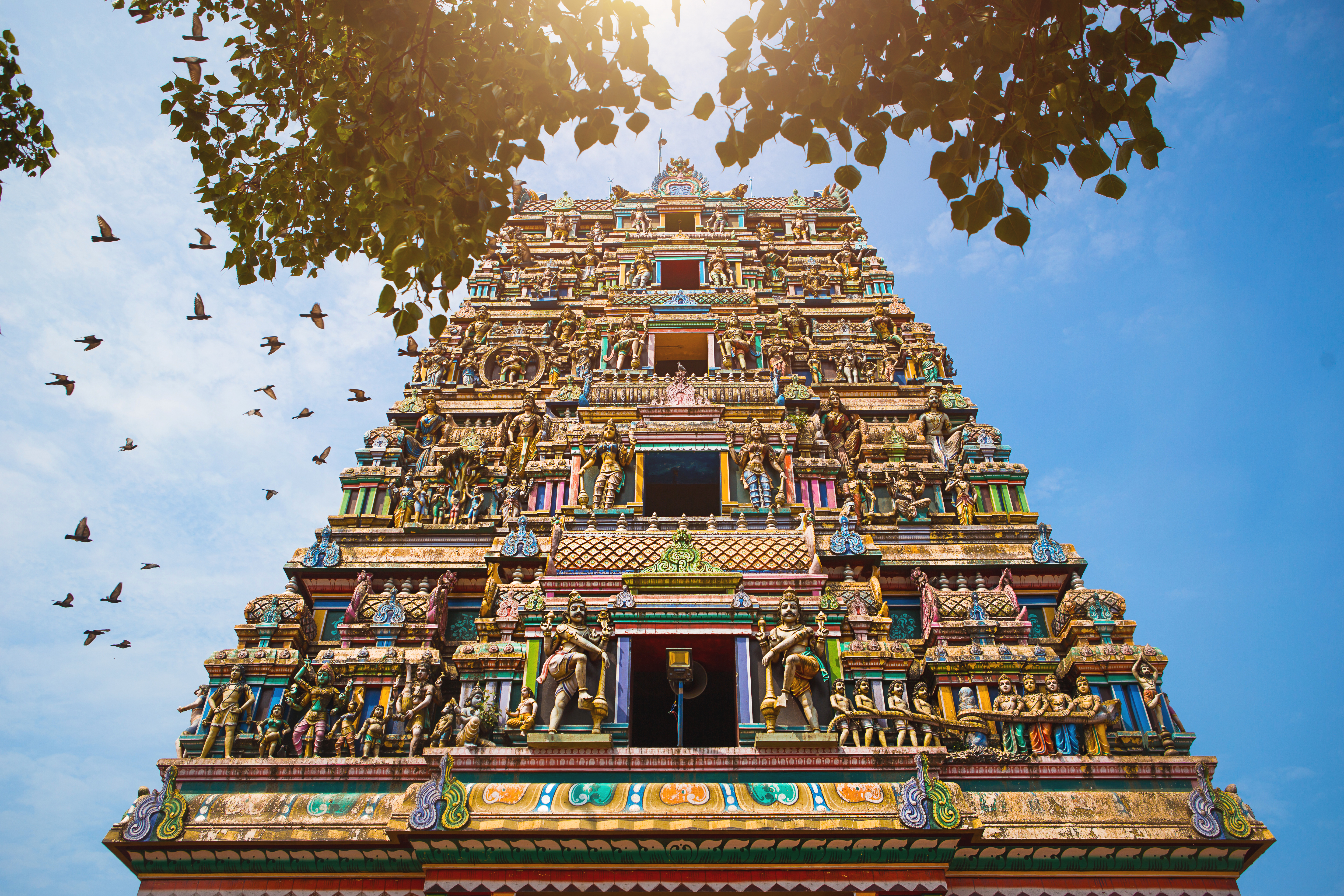 Hindu temple facade under a blue sky